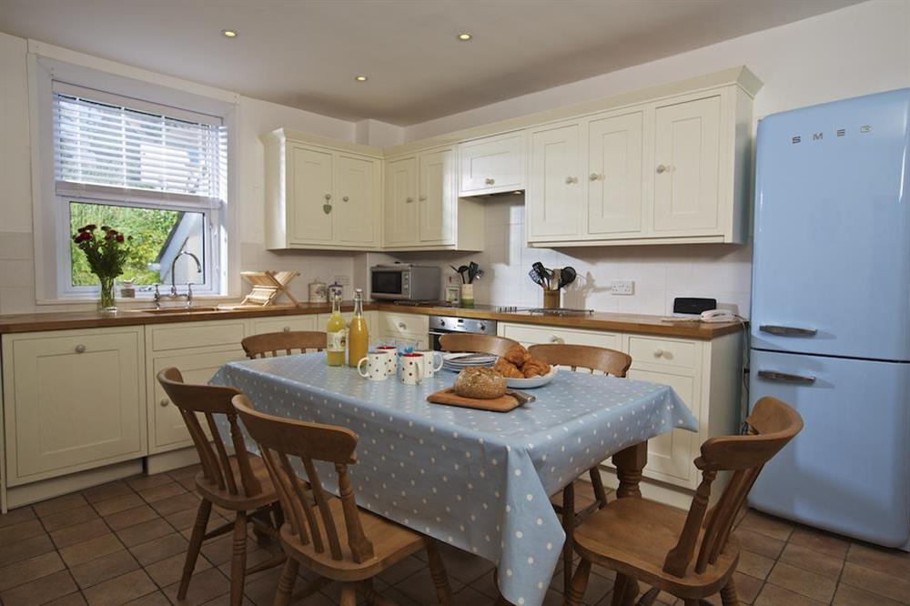 A large fully fitted kitchen and dining room at Orchard Brae in , Thurlestone