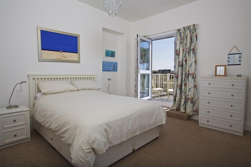 En suite King-size bedroom with large balcony offering excellent views of the sea and golf course at Orchard Brae in , Thurlestone