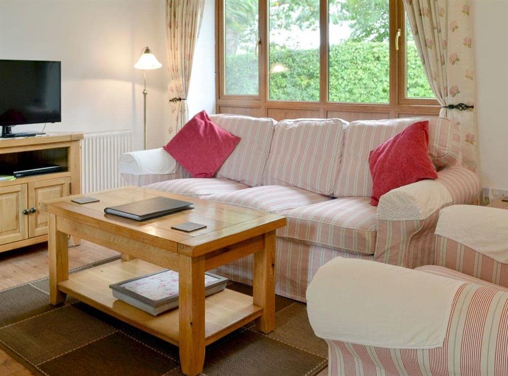 Comfy living area at Orchard Cottage in Lower Gresham, Norfolk