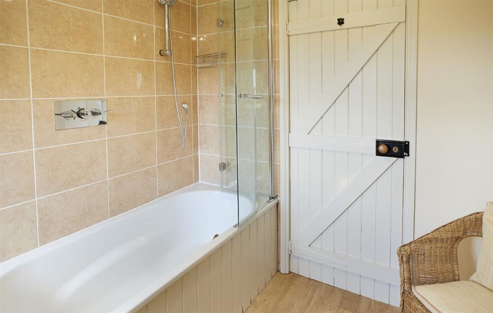 Bathroom with bath and power shower over (photo 2) at Orchard Cottage (Monmouthshire), Penterry