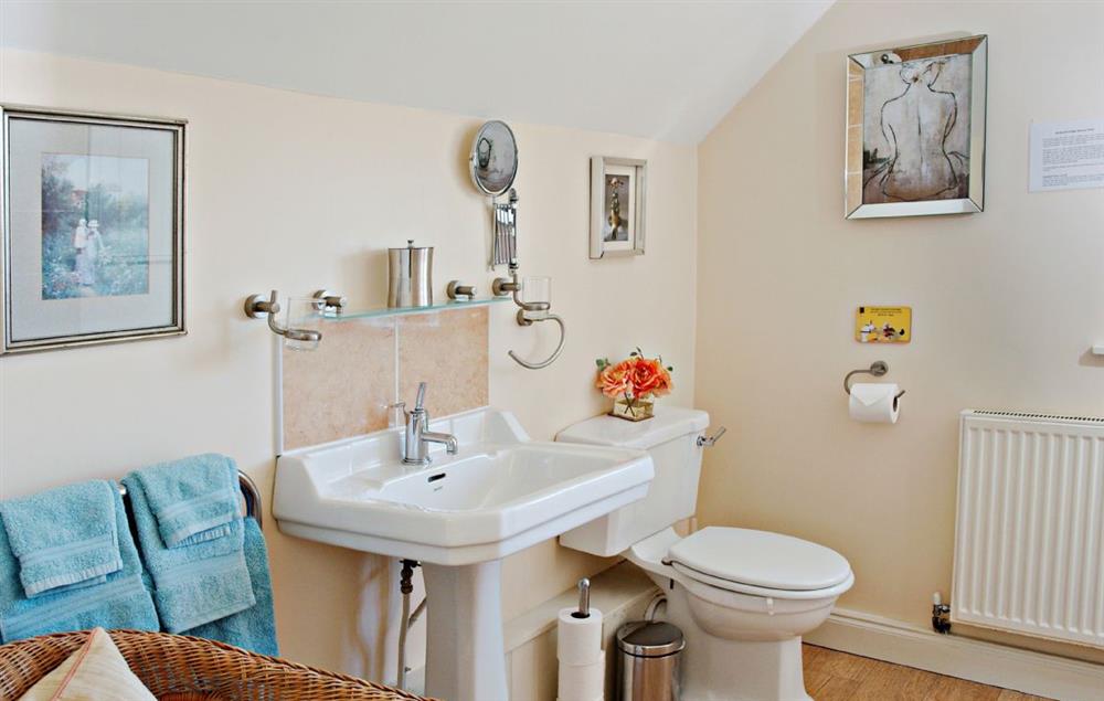 Bathroom with bath and power shower over at Orchard Cottage (Monmouthshire), Penterry