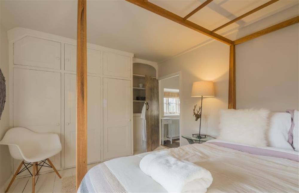First floor: First floor: The master bedroom has king-size four poster bed at Orchard Cottage, Ringstead near Hunstanton
