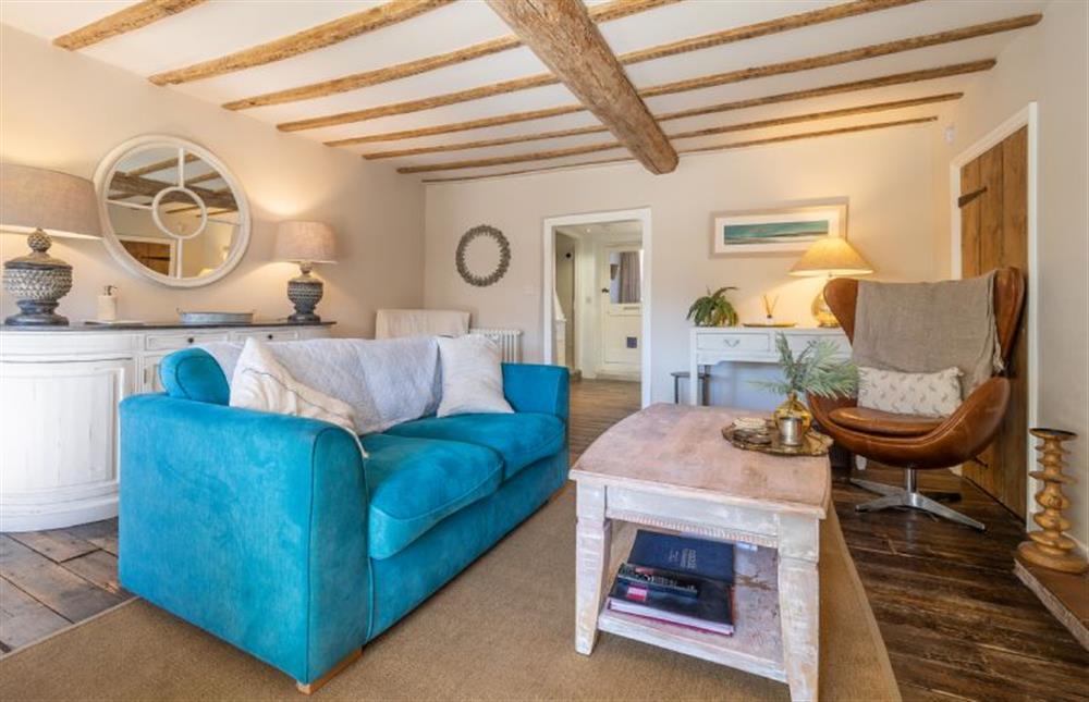Ground floor: Cheerful sitting room has wood burning stove at Orchard Cottage, Ringstead near Hunstanton