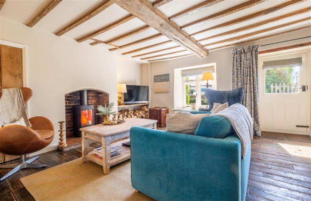 Ground floor: Sitting room with wood burning stove at Orchard Cottage, Ringstead near Hunstanton