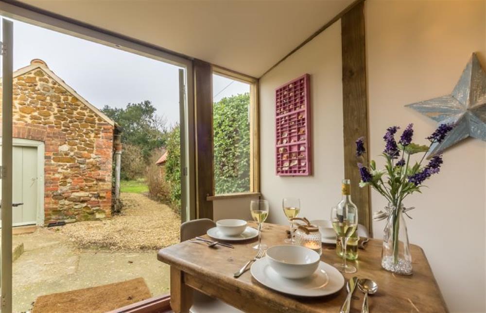 Ground floor: The dining room looks out to the pretty garden at Orchard Cottage, Ringstead near Hunstanton