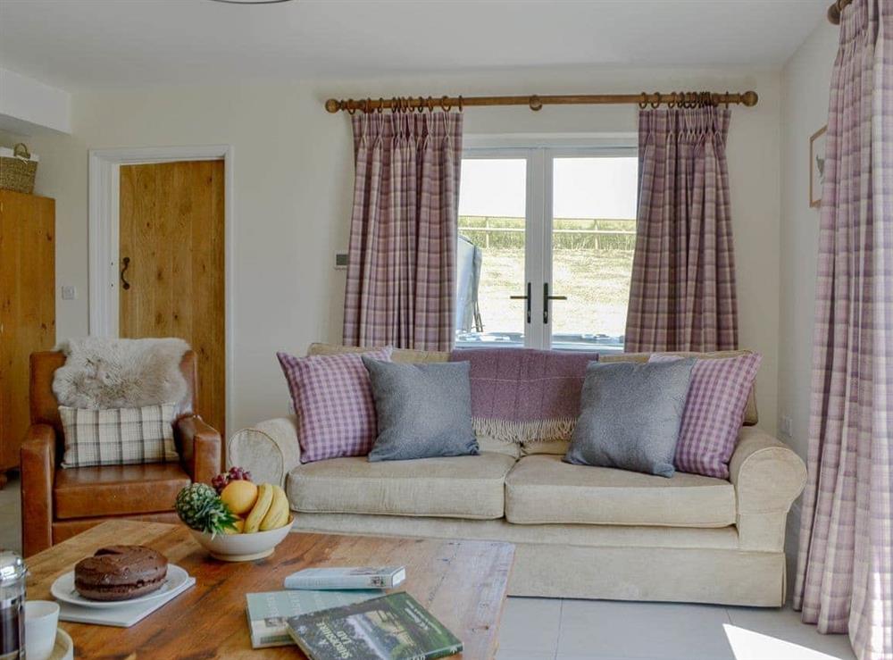 Comfortable living room at Orchard Cottage in Upton Cressett, near Ironbridge, Shropshire
