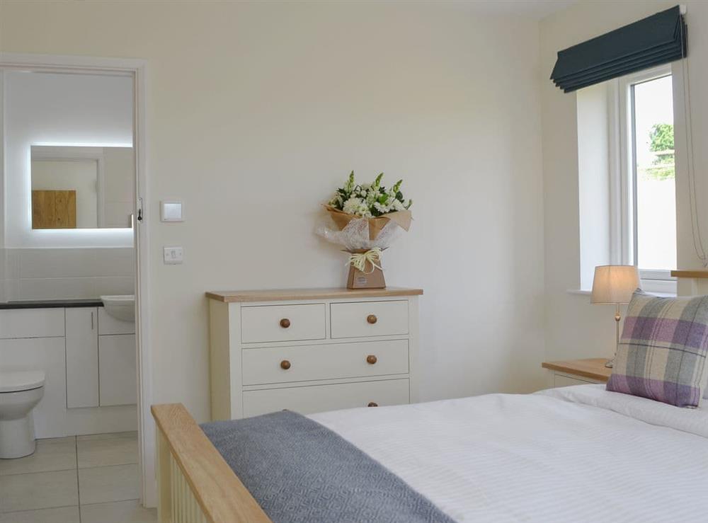 Double bedroom with en-suite at Orchard Cottage in Upton Cressett, near Ironbridge, Shropshire