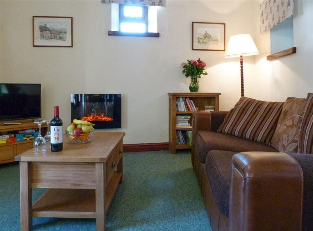 Inviting living room at Orchard Cottage in Wheddon Cross, Exmoor, Somerset