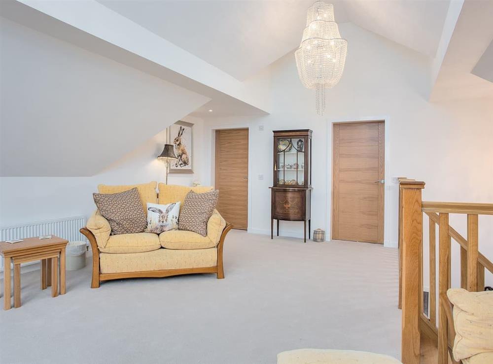 Living room with doors to bedroom 2 and shower room at Orchard House in Auchtermuchty, Fife