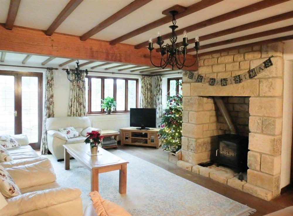 Elegant living room with feature fireplace at Orchard House in Chipping Campden, Gloucestershire