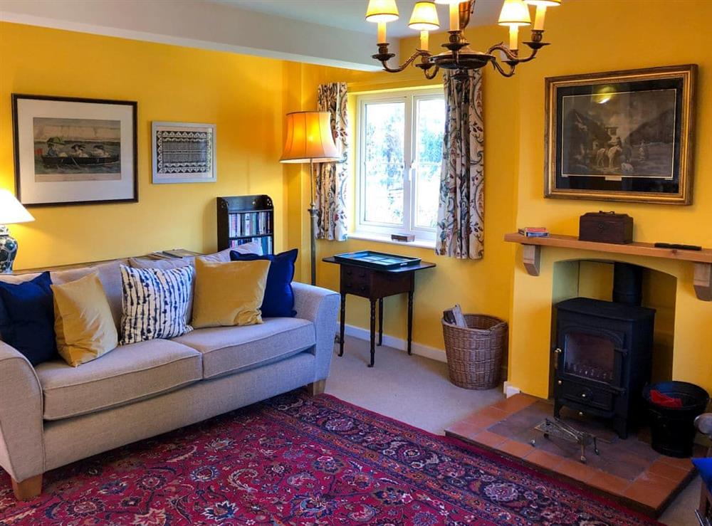 Cosy living room with wood burner (photo 2) at Orchard House in Hempstead, near Holt, Norfolk