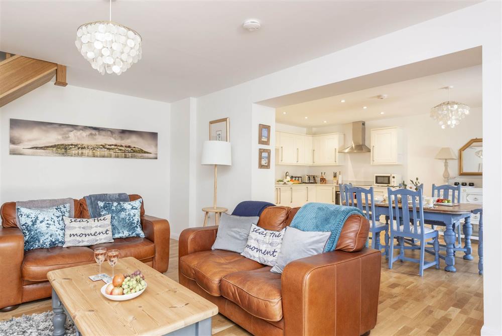 Open-plan sitting room through to kitchen and dining area at Orchard Leigh Cottage, Ventnor