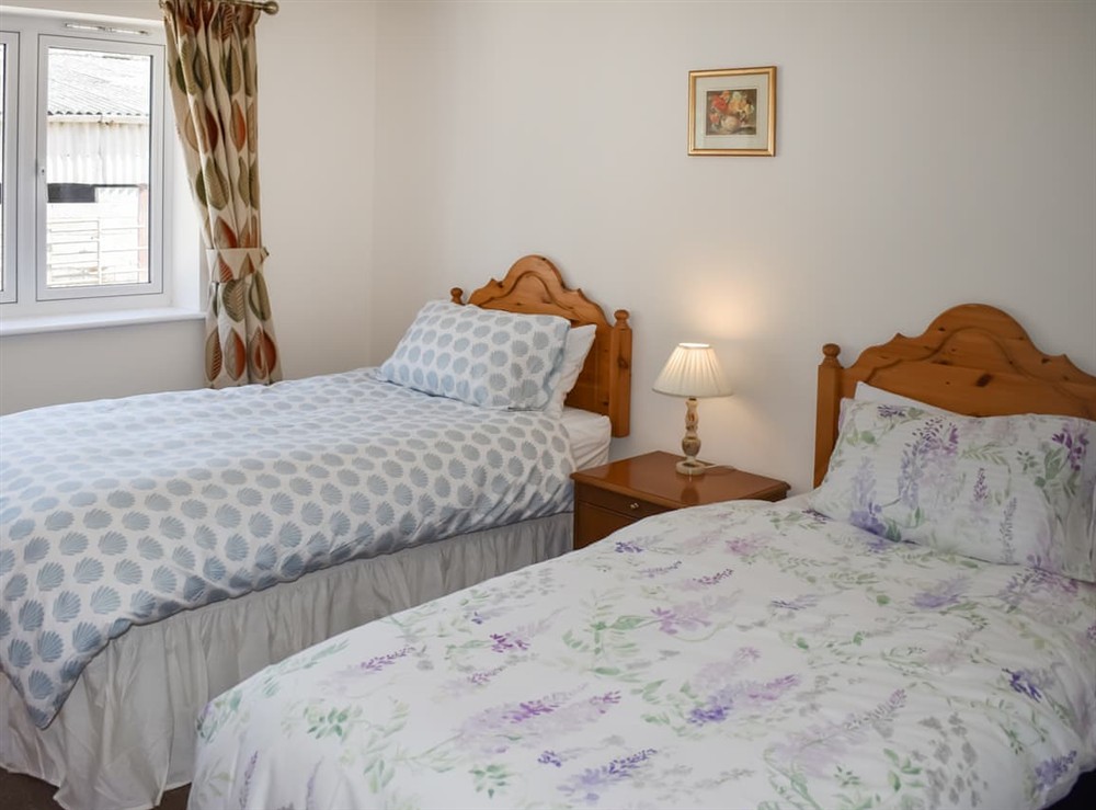 Twin bedroom at Orchard Lodge in Drimpton, near Beaminster, Dorset