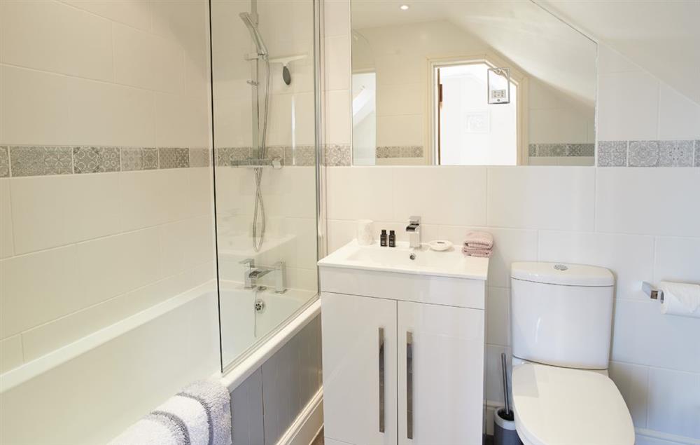 En-suite bathroom with shower over bath at Orchard View, Pulverbatch