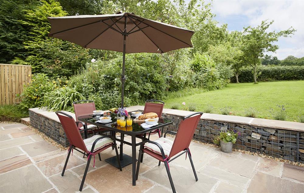 Patio and garden at Orchard View with garden furniture for al fresco dining at Orchard View, Pulverbatch