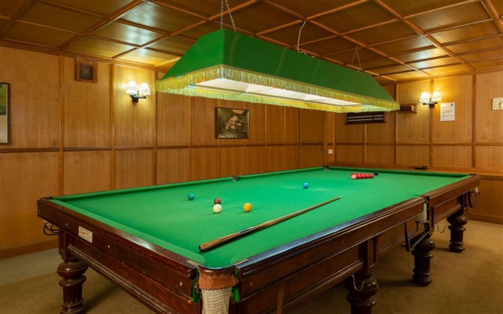Wood panelled snooker room  at Orchid Cottage in Sherford