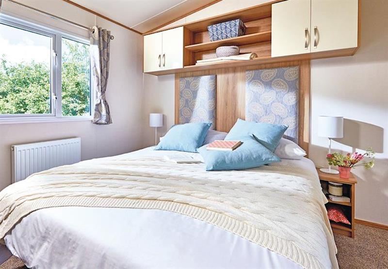 Double bedroom in a Ord Deluxe Caravan at Ord House Country Park in Berwick-upon-Tweed, Northumberland