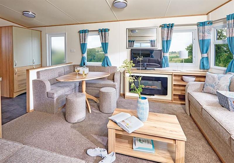The living room in a Ord Deluxe Caravan at Ord House Country Park in Berwick-upon-Tweed, Northumberland