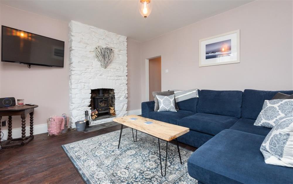 The charming lounge with wood burning stove. at Osbornes, 2 Retreat Cottages in Wadebridge