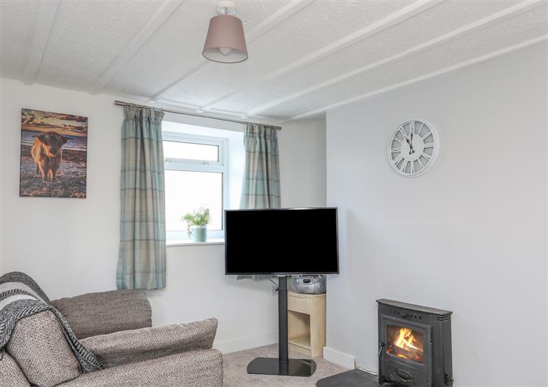 Relax in the living area at Oscars Pad, Brynsiencyn