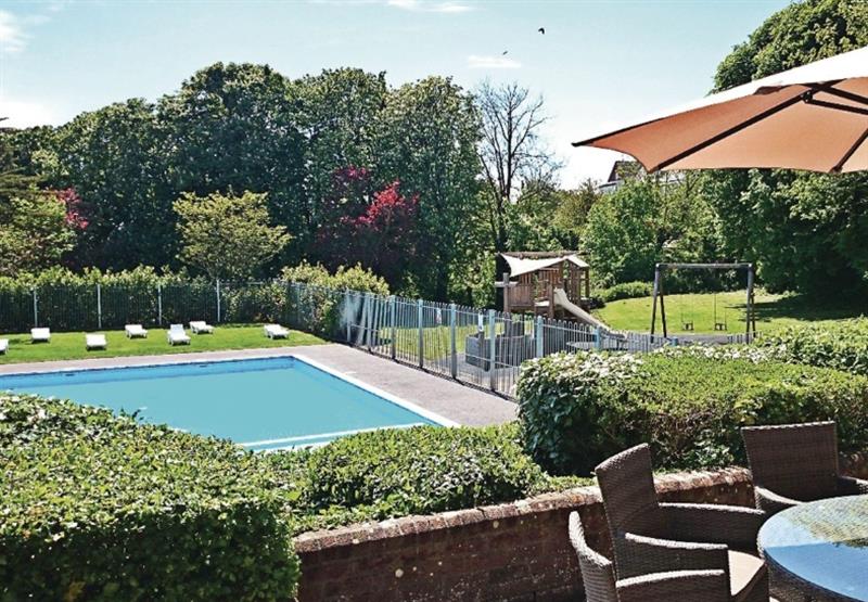 Outdoor heated swimming pool at Osmington Holiday Park in , Dorset