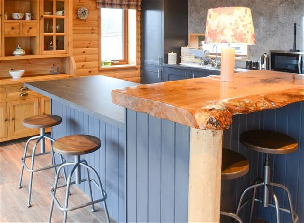 Well appointed kitchen with breakfast bar at Osprey Lodge in Rogart, near Dornoch, Northern Highlands, Sutherland