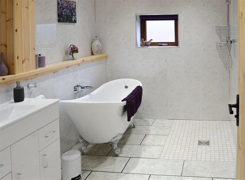 Wet room with roll top bath and walk in shower at Osprey Lodge in Rogart, near Dornoch, Northern Highlands, Sutherland