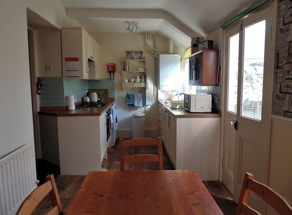 Kitchen with dining area at Oswin Cottage in Alnwick, Northumberland