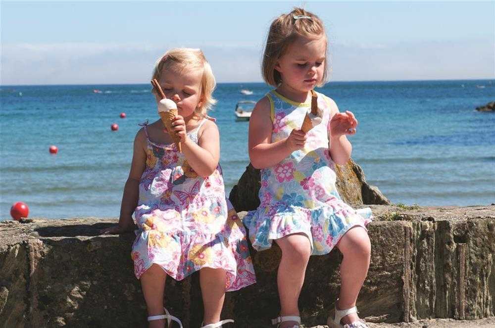 Children enjoying an ice cream in Salcombe at Overcombe in , Salcombe