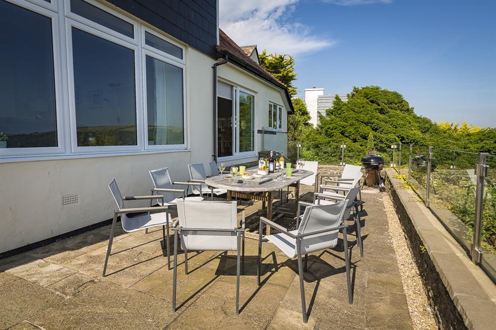 Large terrace with table and chairs overlooking Salcombe Estuary at Overcombe in , Salcombe