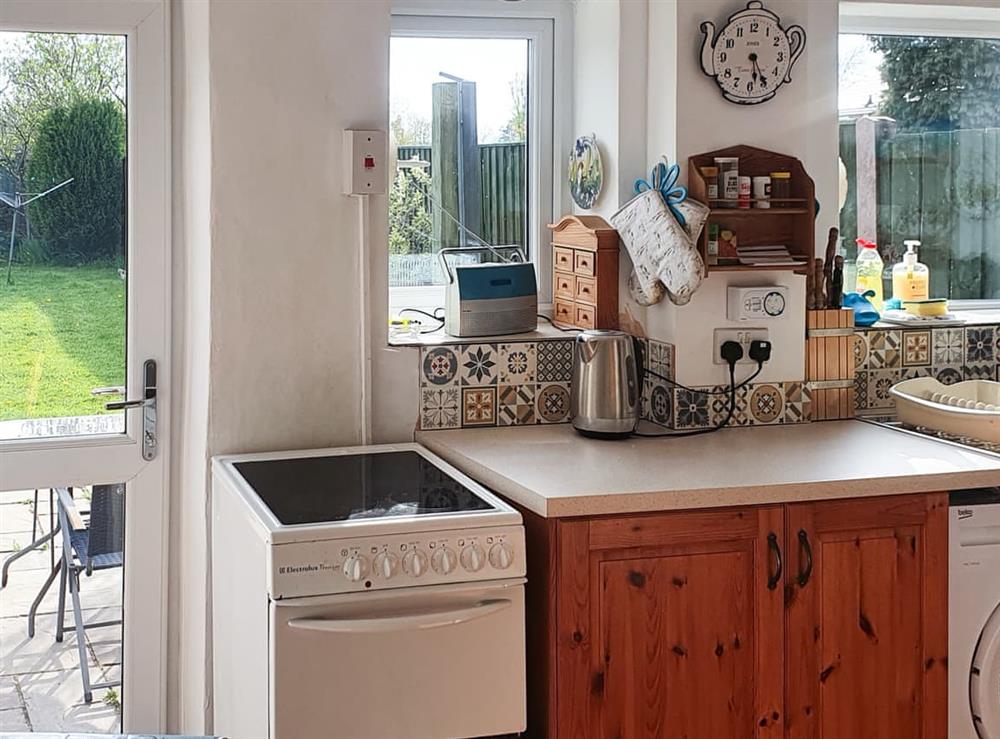 Bright kitchen leads straight to the patio at Owl Cottage in Crich, near Matlock, Derbyshire