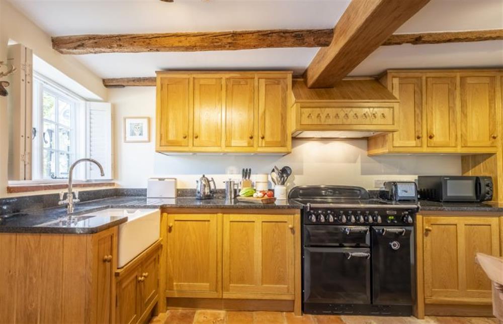 A well equipped country style fitted kitchen at Owl Cottage, Stiffkey near Wells-next-the-Sea