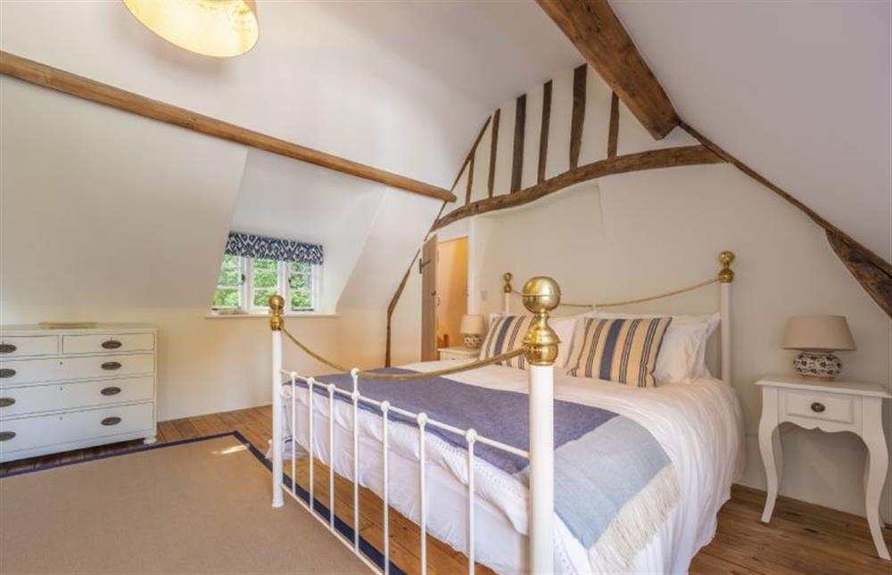 Master bedroom with 5’ king-size bed at Owl Cottage, Stiffkey near Wells-next-the-Sea