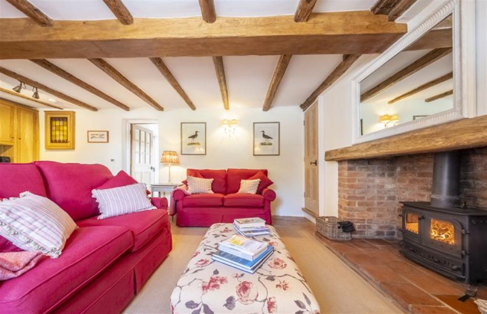 Take a seat beside the wood burning stove at Owl Cottage, Stiffkey near Wells-next-the-Sea
