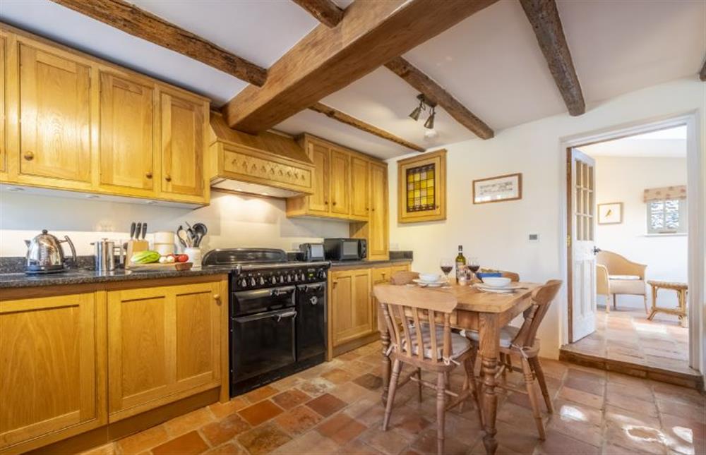 The kitchen includes a dining area at Owl Cottage, Stiffkey near Wells-next-the-Sea
