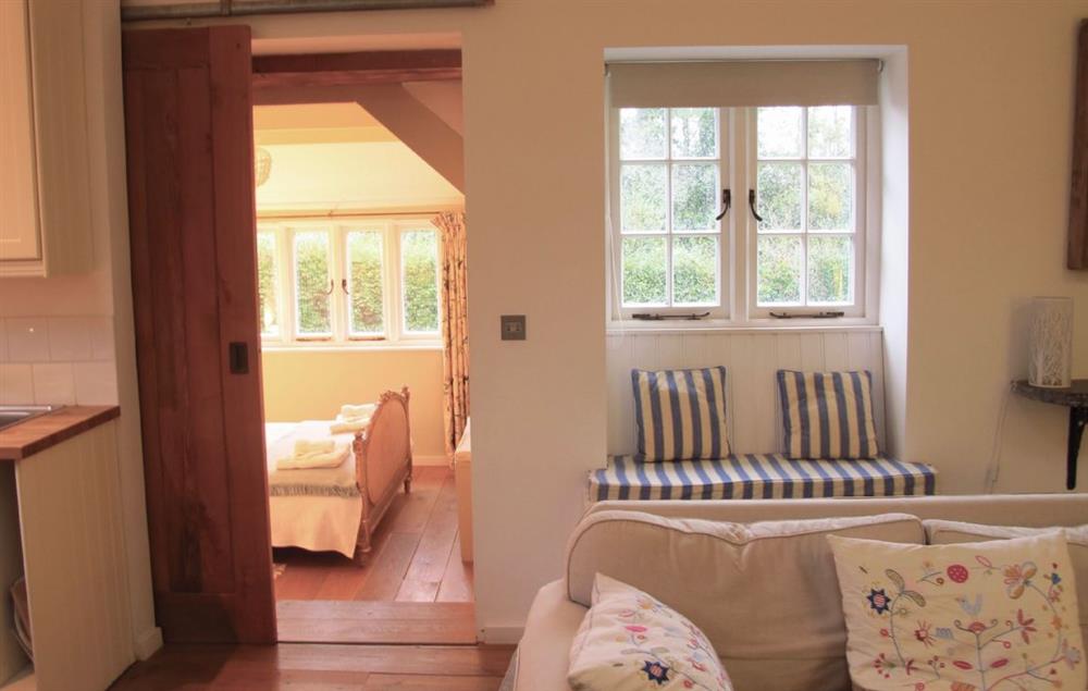 View of sliding oak door to bedroom at Owl House, Treneague