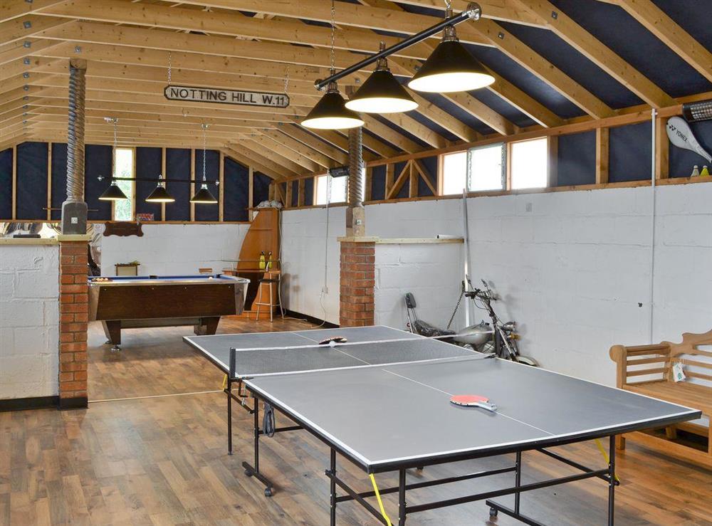 Table tennis in the on-site games room at Owl Lodge in Forncett St Peter, near Long Stratton, Norfolk