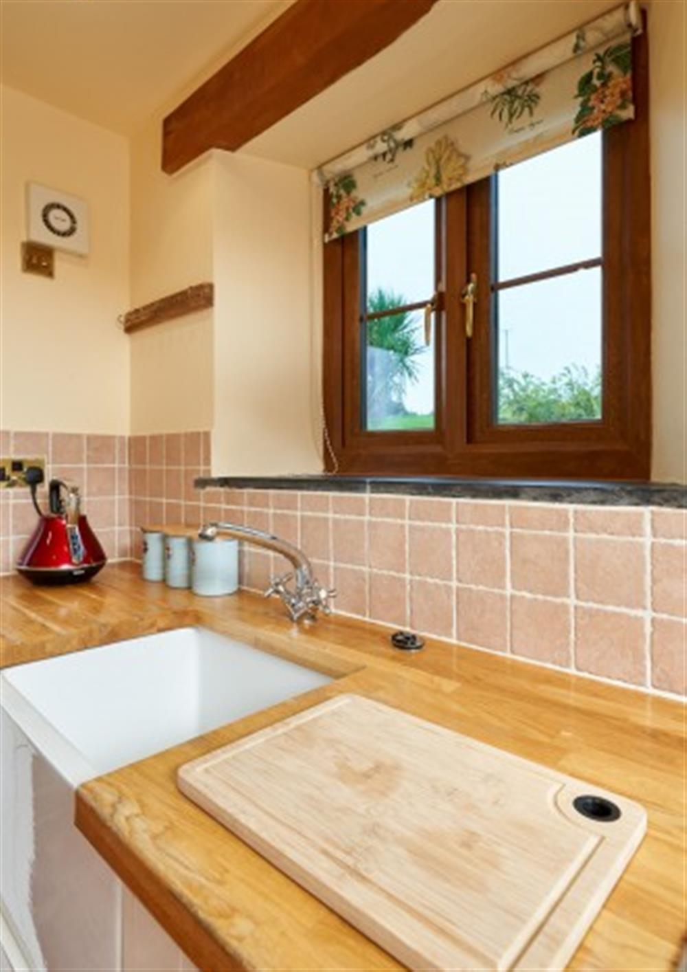 Country views make washing up less of a chore. at Owlacombe Cottage in Slapton
