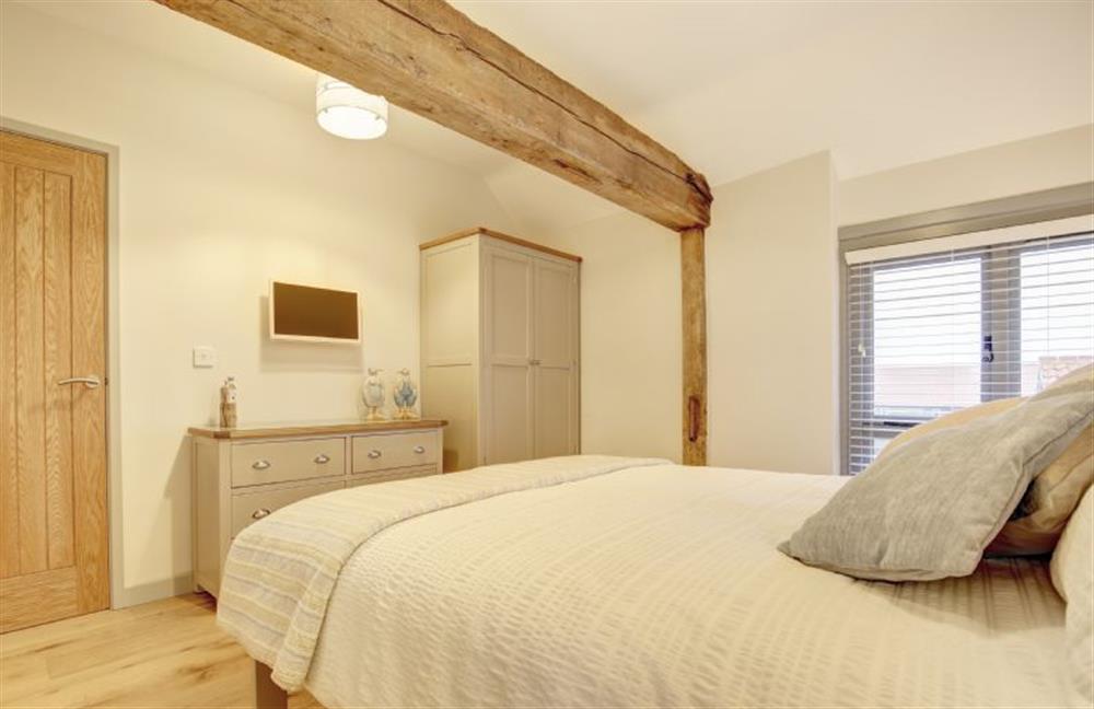 First floor: Bedroom two has king-size bed (photo 3) at Owlets at Mulberry Barn, Heacham near Kings Lynn