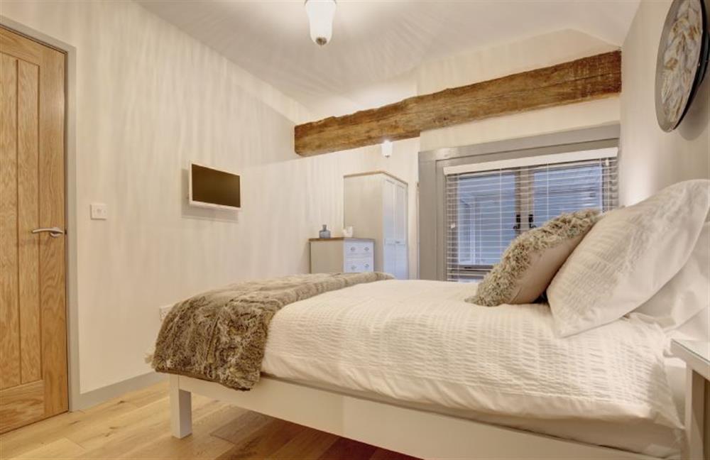 First floor: Master bedroom has en-suite shower room at Owlets at Mulberry Barn, Heacham near Kings Lynn