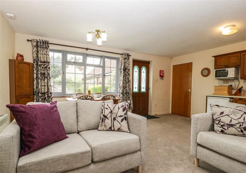 Relax in the living area at Owls Retreat, Brean