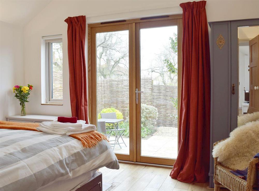 Lovely ouble bedroom with direct access to the private garden at Owls Roost in Aldeburgh, Suffolk