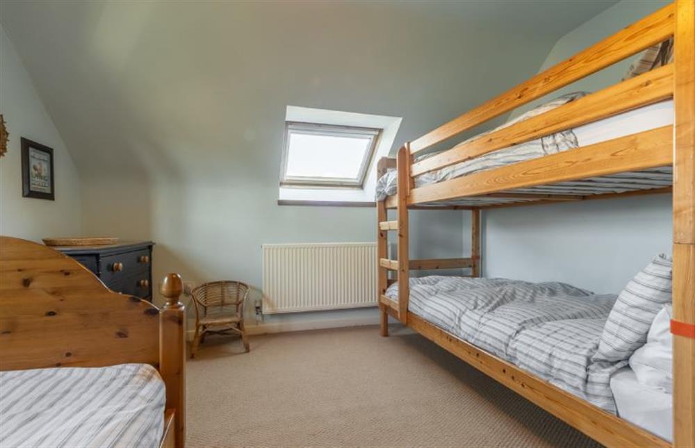 First floor: Bedroom four has a single and a bunk bed at Oyster Barn, Titchwell near Kings Lynn