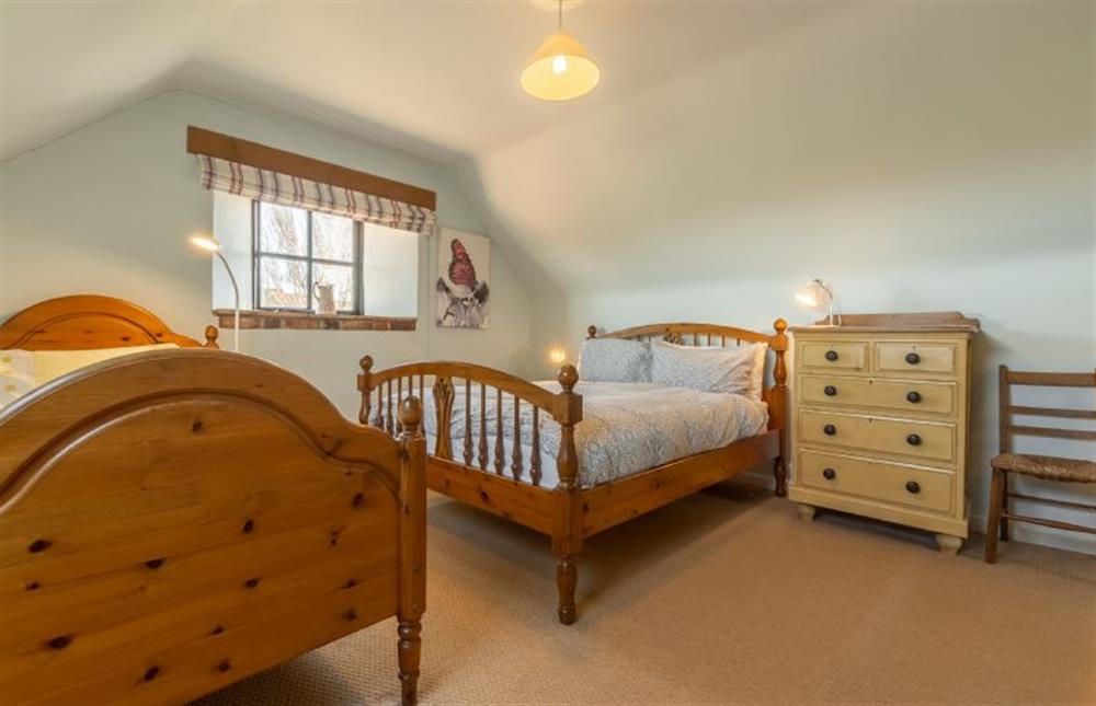 First floor: Bedroom three has a double and a single bed at Oyster Barn, Titchwell near Kings Lynn