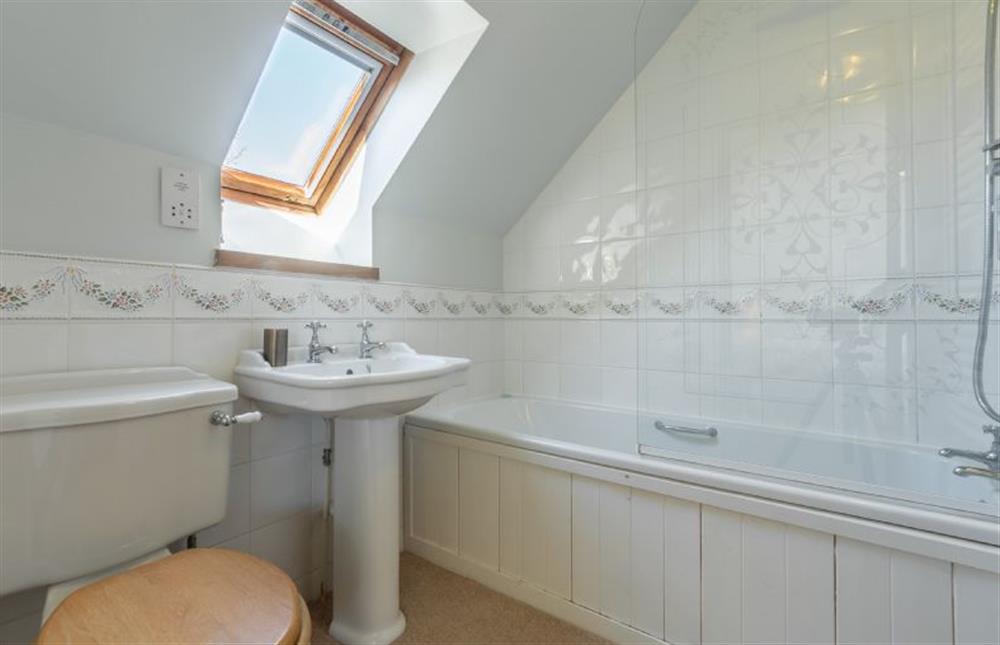 First floor: Bedroom two, en-suite bathroom at Oyster Barn, Titchwell near Kings Lynn