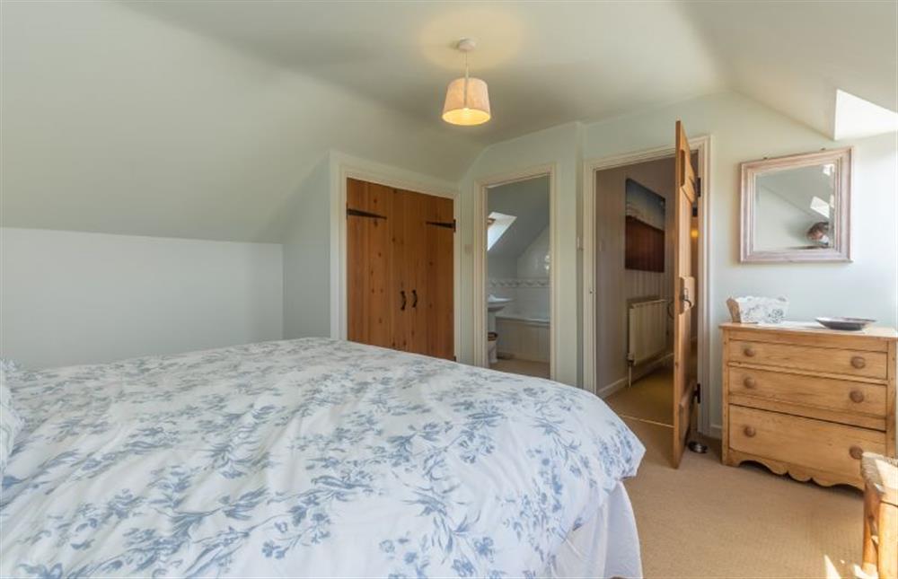 First floor: Bedroom two, super-king size bed (photo 3) at Oyster Barn, Titchwell near Kings Lynn