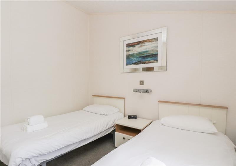 A bedroom in Oyster Bay Lodge at Oyster Bay Lodge, Dalbeattie
