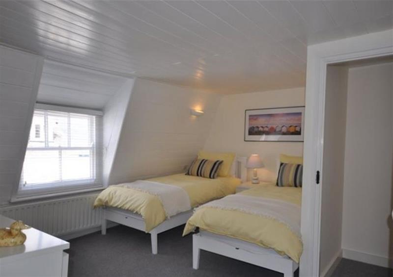 A bedroom in Oyster Cottage at Oyster Cottage, Weymouth