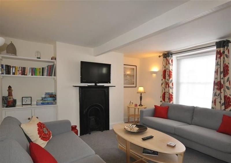 Relax in the living area at Oyster Cottage, Weymouth