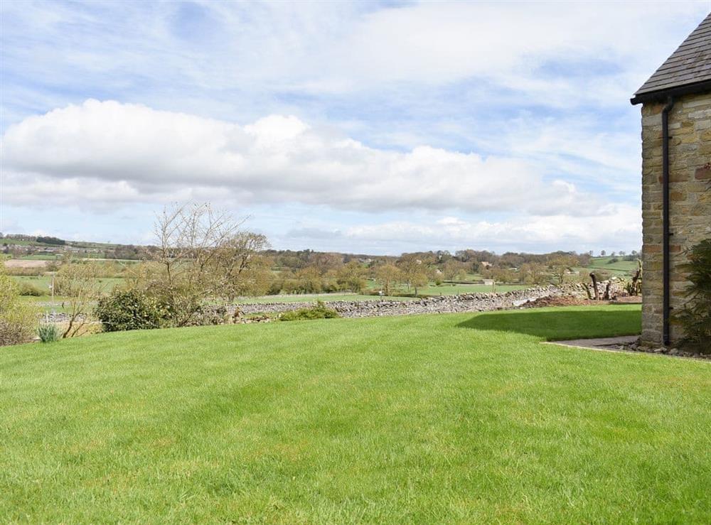 Large lawned garden at Paddock House in Middleham, near Leyburn, North Yorkshire